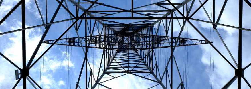 low angle photograph of black metal tower satellite during daytime